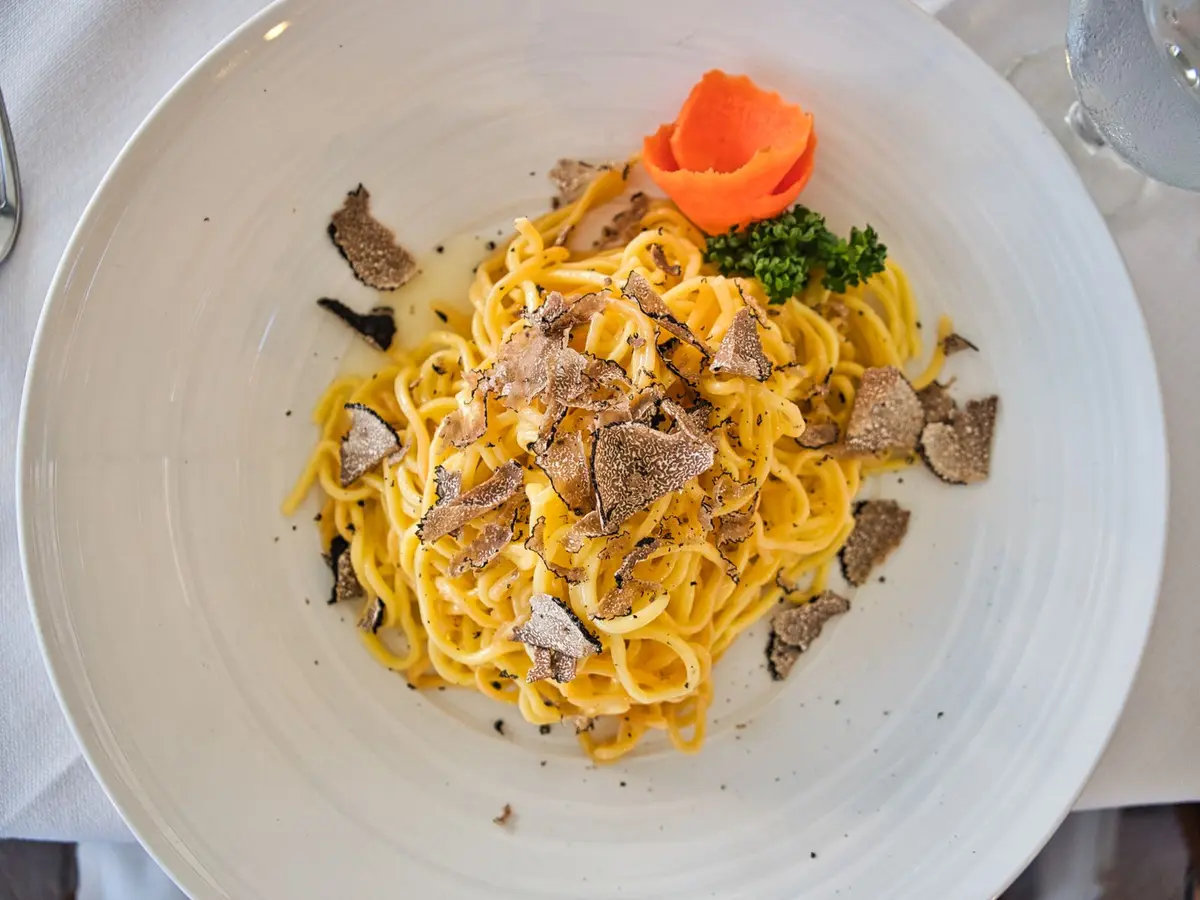 Fresh pasta finished with shavings of black truffle